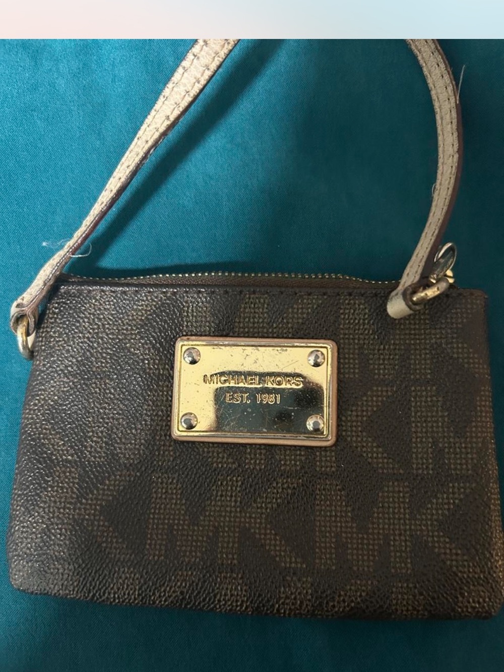 Michael Kors Brown Monogram Wristlet with Gold Plaque and Cream Strap